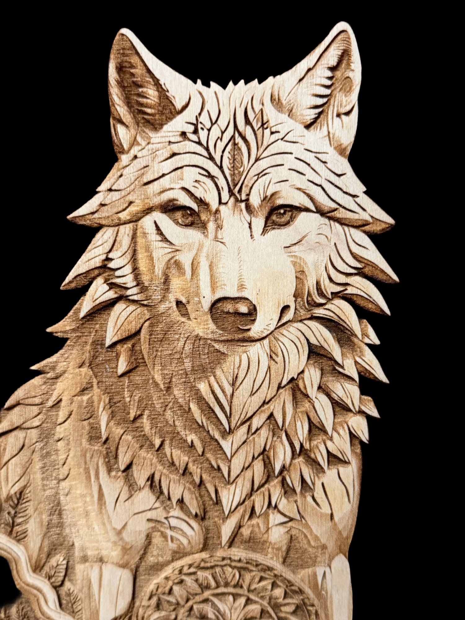 Detailed wolf engraving on wood