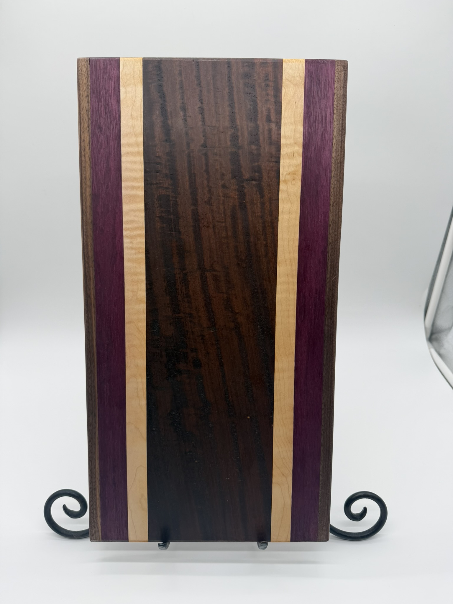 Walnut, purpleheart, and maple striped board