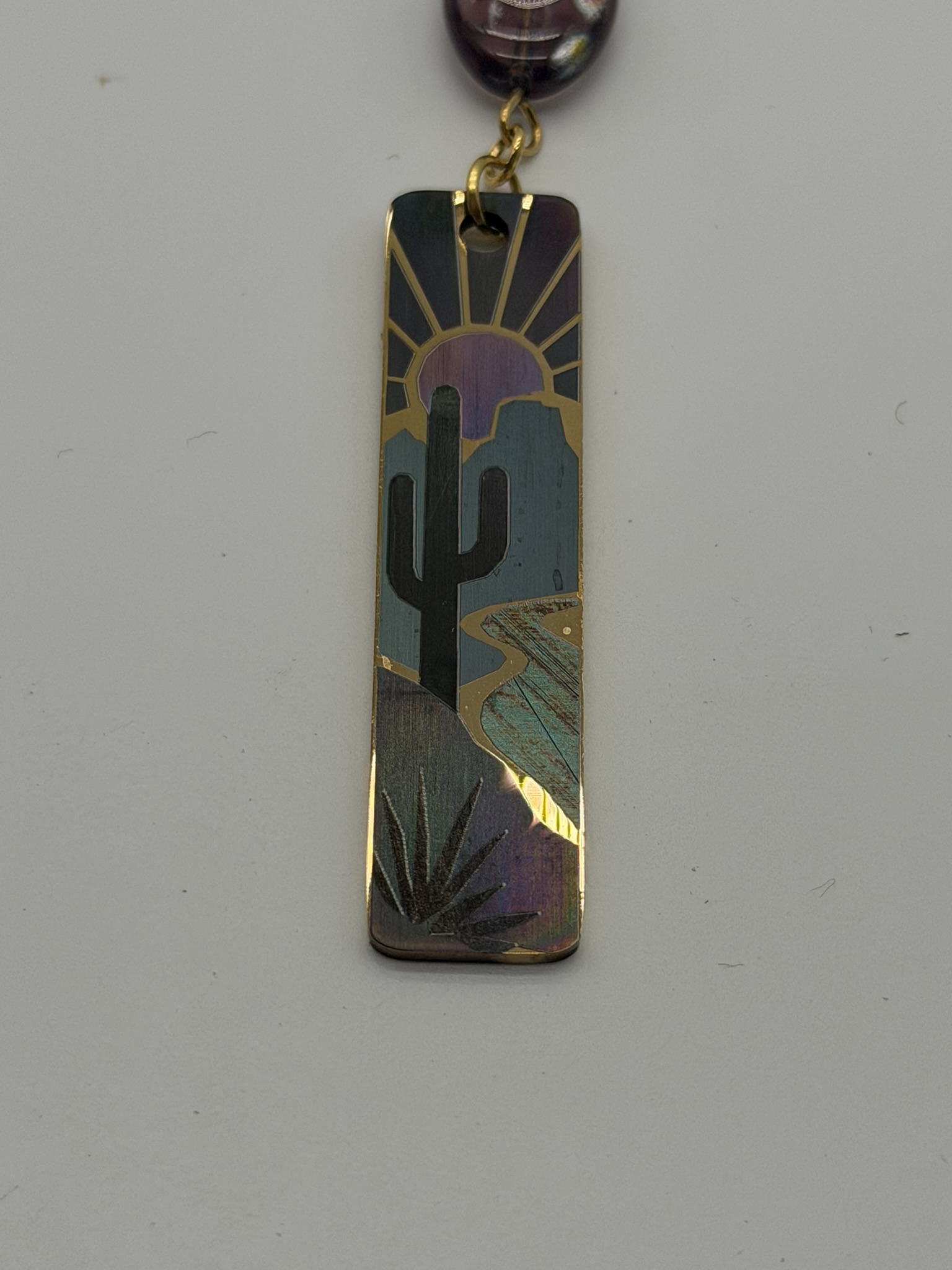 Color-marked stainless desert cactus pendant