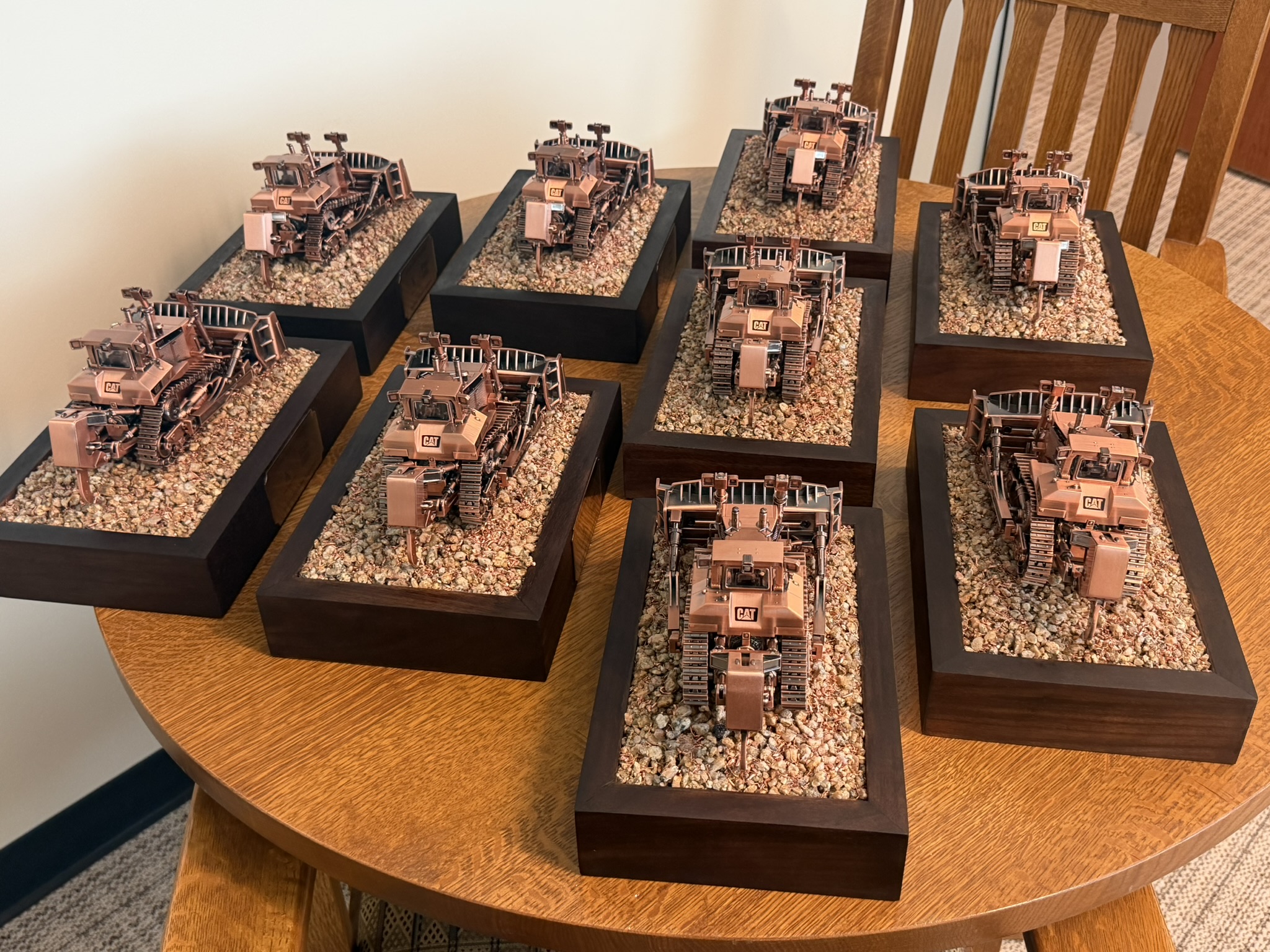 Set of copper CAT dozer award plaques made as a corporate gift